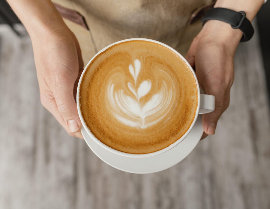 A cup of coffee placed on a table, symbolizing the boost of energy it provides for runners.