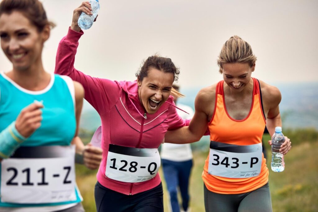 Two people running in a 5K race, showcasing their progress from Couch to 5K training.